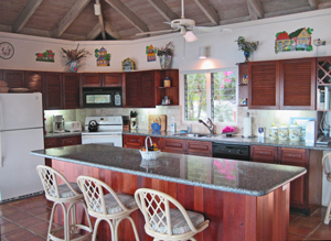 St John rental home Altamira spacious kitchen with tropical decor and large countertop bar space
