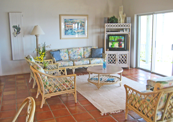 St John rental home Altamira living room with wicher furniture and sliding glass doors