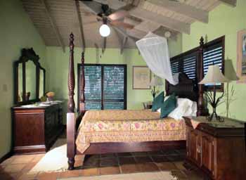 St John vacation rental Meridian large, high ceiling master bedroom with mahogany furniture and king sized bed