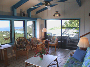St John USVI vacation rental Tesseract living room with sliding glass doors  that openonto covered deck 